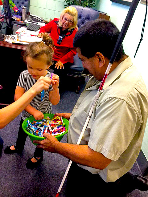 Pete is handing out halloween candy.